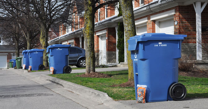 A million homes across Ontario will take part in a curbside collection to recycle batteries this fall. Image shows clearly marked bags of batteries setout beside recycling containers. This service is only offered in some communities.