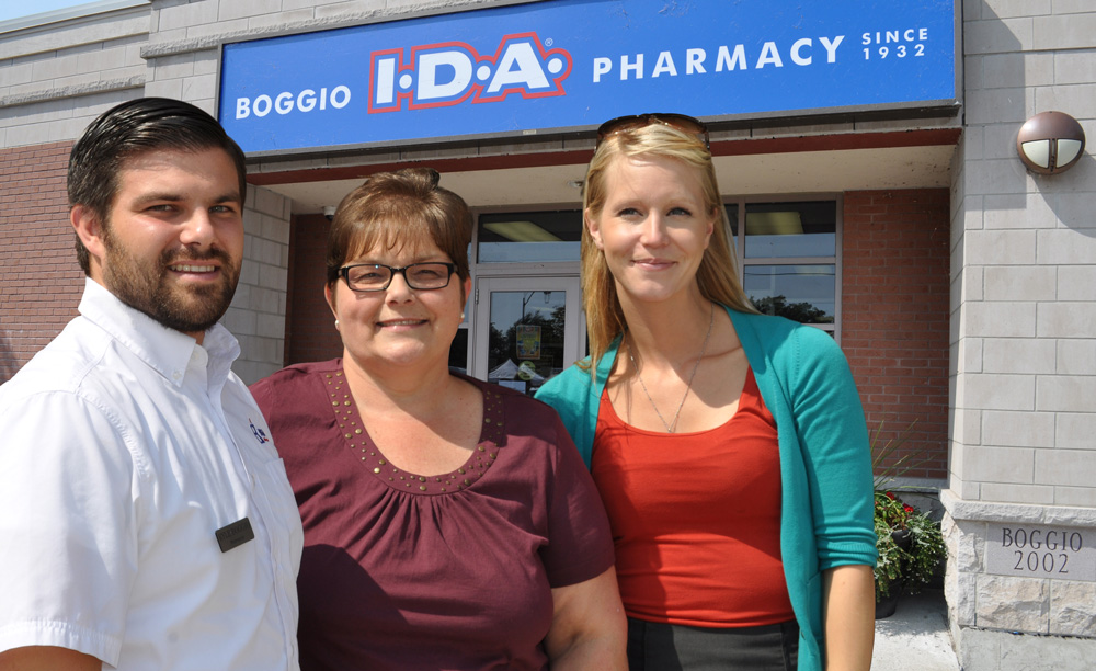 Sarah Lacharity of Raw Materials Company thanks Sharon Riddell and Kyle Boggio of Boggio's Pharmacy for recycling more than 2000 kilograms of household batteries from the public