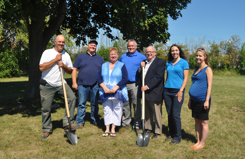 Mike Audit, Mike Graybeil, Councillor Angie Desmarais, Scott Luey, Mayor John Maloney, Amanda Upper and Sarah Lacharity pose for a picture at the site of the new community garden at Lockview Park in Port Colborne Ontario.