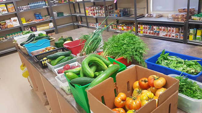 The Lockview Park Community Garden brought in a bounty of 853 kilograms of fresh, healthy produce to the Port Cares Food Bank. The picture shows fresh produce sitting across a table in the Port Cares pantry. 