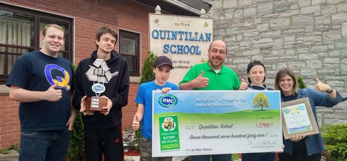 Ben Kersley of Raw Materials Company awards Quintilian Private School of Kingston with a 1st place trophy and cheque for winning the Ontario Schools Battery Recycling Challenge
