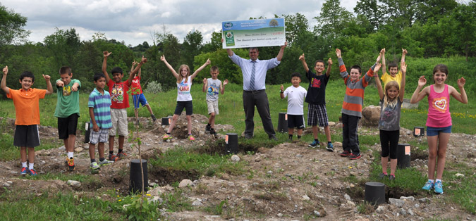 Rhema Christian School Students pose for a picture on the site where their eco classroom will be built using money received from winning the Ontario Schools Battery Recycling Challenge