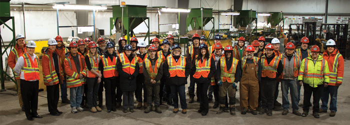 Staff at Raw Materials Company pose for a group picture after recieving the Technological Innovation award from NEYA